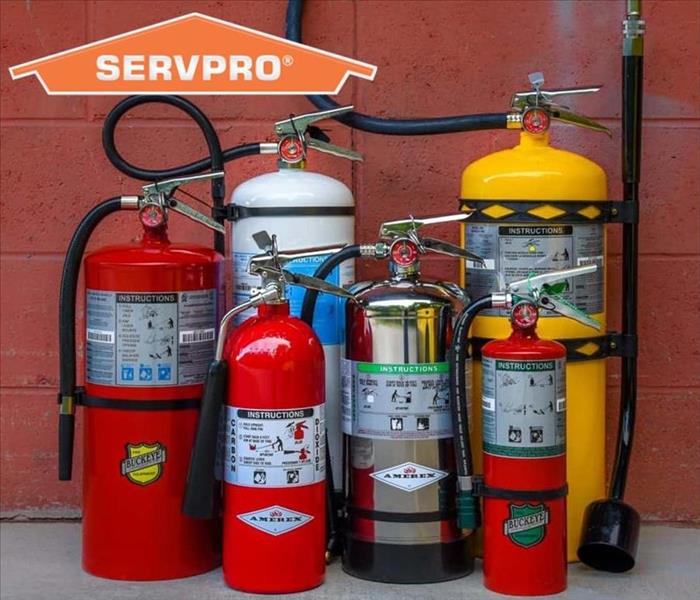 Multiple Fire Extinguishers with SERVPRO logo
