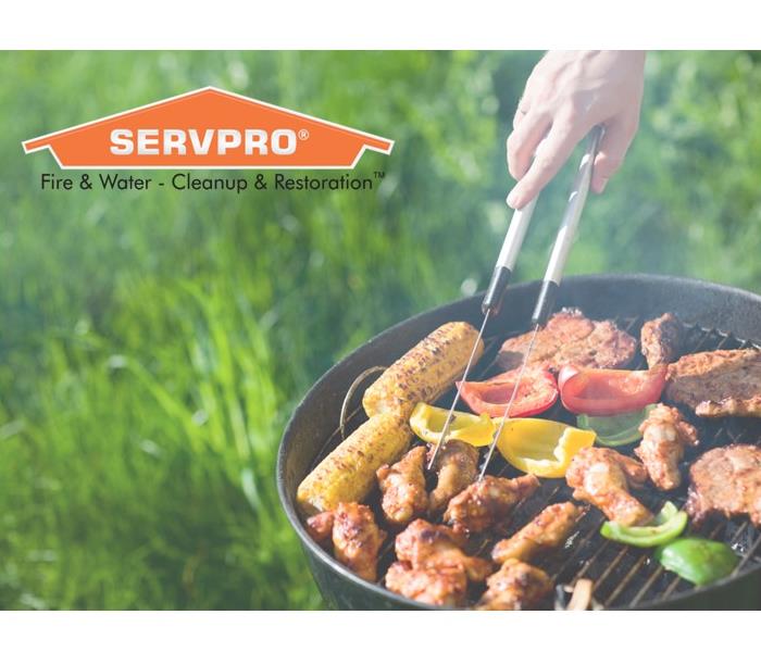 SERVPRO logo alongside a grill being used outdoors